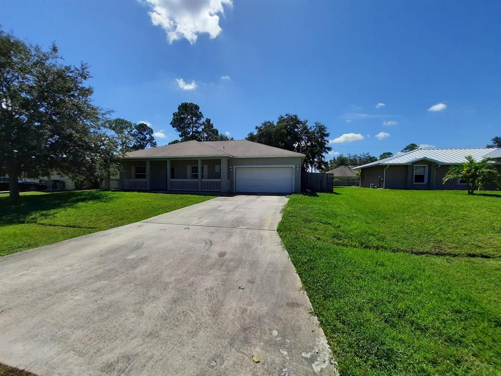 Photo of 950 SW Fenway Road, Port Saint Lucie, FL 34953 (MLS # R10744612)