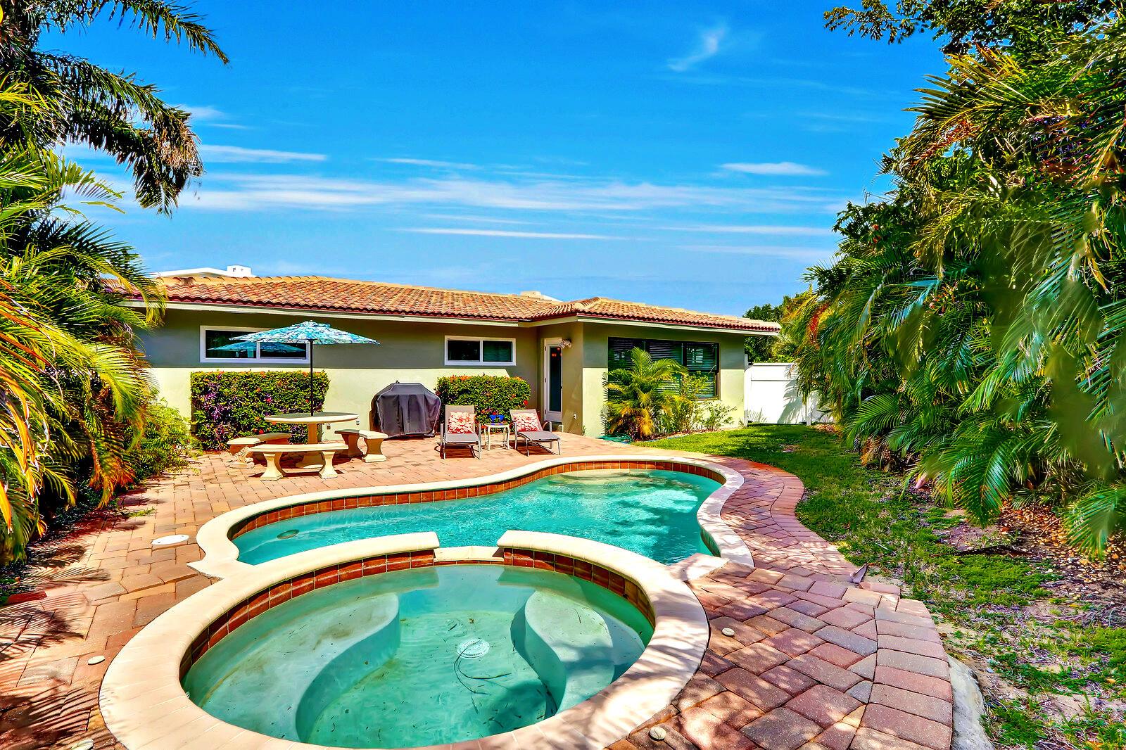 *PRIVATE POOL* *AVAILABLE NOW* Presenting a fully furnished escape like no other. Steps to the sand in Juno Beach, you will discover this 2 bedroom + den, 2 bath private pool home designed for vacation or staycation. Enter this bright home to find a fully equipped kitchen with gas range and bar overlooking a spacious great room framed by over-sized windows providing tropical views of your fenced yard and sparkling pool and spa. Enjoy a poolside sunset before calling it a night then explore two well appointed bedrooms with new carpet and incredibly comfortable beds. Beyond two updated bathrooms you will find a quiet den with a couch. All this located across from miles of sandy beaches and beautiful Atlantic waters, parks and minutes from world class dining, shopping and recreation.