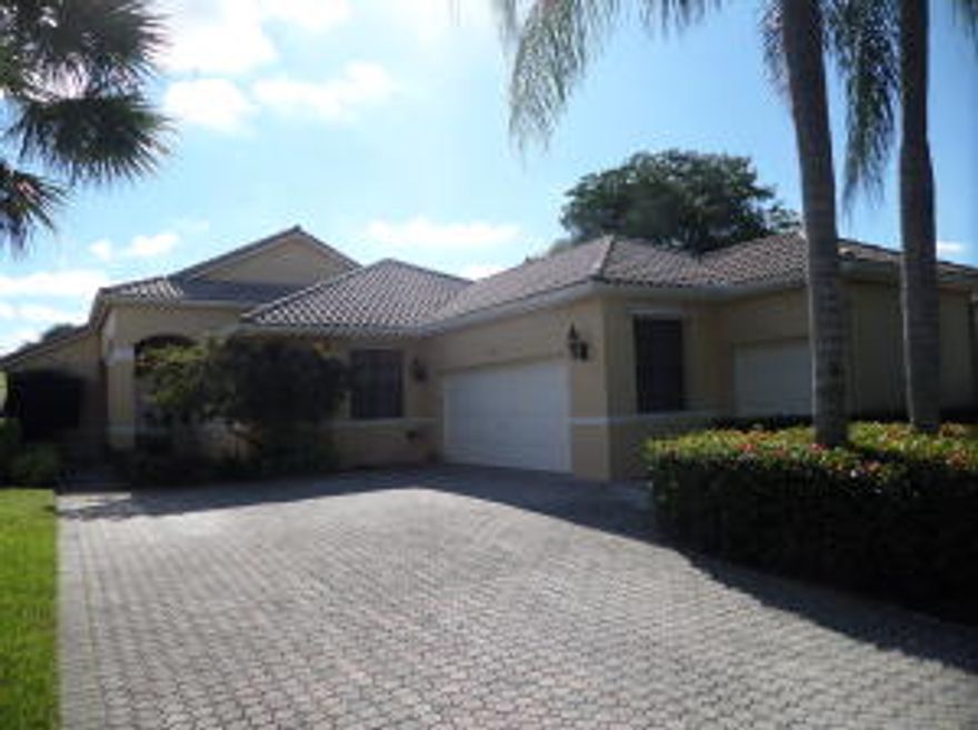 Enjoy the sunrise and rolling golf course views here in Dover at Wycliffe Golf and Country Club. The expanded paved patio is screened and open with heated pool perfect for entertaining. Inside the home also enjoys the view through 3 paned sliding glass doors with transom windows and plantation shuttered windows. Tiled throughout living areas with high vaulted ceilings including birch and oakwood wet bar and entertainment center with glass shelves and recessed lighting. Large wrap around kitchen with tons of counter space and storage with large breakfast area. Master bedroom with his and her walk-in closets has sliding door access to patio. Master bath features double sinks and vanity, Jacuzzi, separate shower and bidet. Large guest bedroom with shower enclosure bathroom. Cont... Third bedroom has desk and library with recessed lighting. Cabana bath has shower enclosure. Home features intercom and central vac. Furniture negotiable.  Wycliffe Golf & Country Club, showcases two challenging 18 hole PGA National Golf courses with contrasting styles; 16 Har Tru tennis courts; a full service club house offering daily dining options, fitness center & programs, spa services, card games, library, pools and a huge variety of social events and best of all, it's in the heart of beautiful Wellington, Florida, just minutes from the West Palm Airport. Centrally located with easy access to Boca Raton and Palm Beach Gardens, the best in country club living is waiting for you to enjoy here at Wycliffe. Yes, You Deserve It!