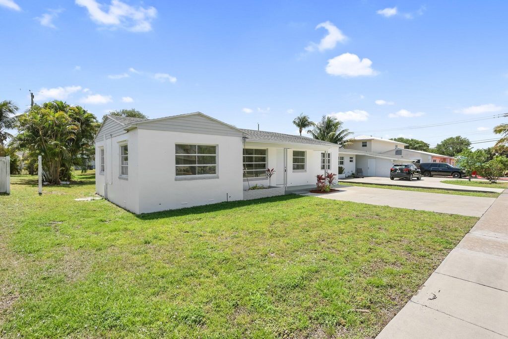 Photo of 344 Cypress Drive, Lake Park, FL 33403 (MLS # R11058616)