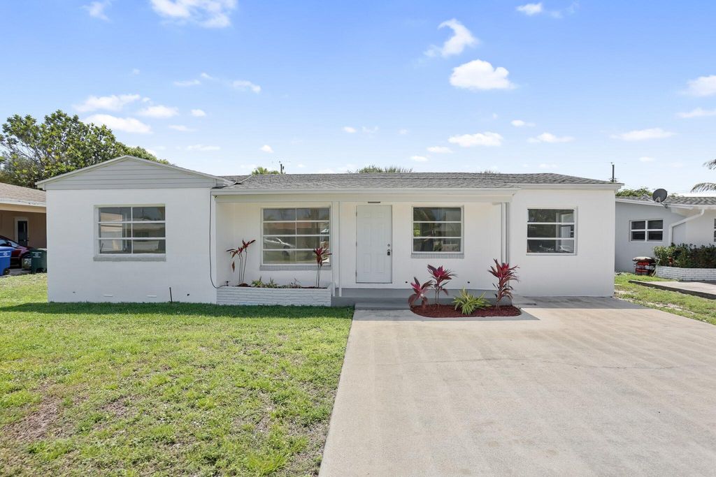 Photo of 344 Cypress Drive, Lake Park, FL 33403 (MLS # R11058616)