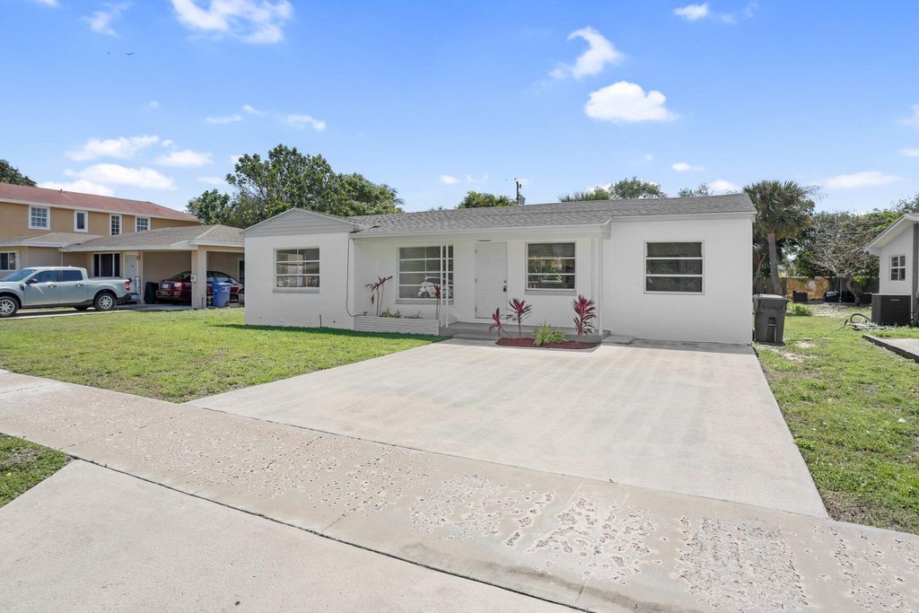 Photo of 344 Cypress Drive, Lake Park, FL 33403 (MLS # R11058616)