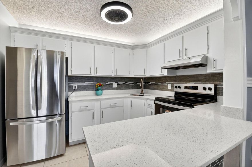 This freshly painted 2-bedroom, 1-bath condo offers a perfect blend of modern updates and inviting charm. The kitchen has been beautifully updated with new quartz countertops, modern lighting, and ceiling fans throughout. Laminate flooring runs seamlessly through the home, complemented by crown moulding and a fully renovated bathroom with contemporary finishes. Located on the second floor, this light and bright unit enjoys plenty of natural sunlight and a peaceful setting. With a low HOA and move-in-ready condition, this home is perfect for comfortable living or as a smart investment opportunity.