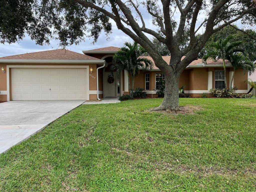 Photo of 6769 NW Abigail Avenue, Port Saint Lucie, FL 34983 (MLS # R11038952)
