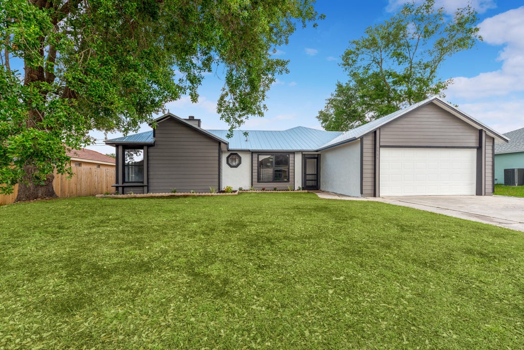 Photo of 3989 SW Jarmer Road Rd, Port St Lucie, FL 34953 (MLS # R10790165)