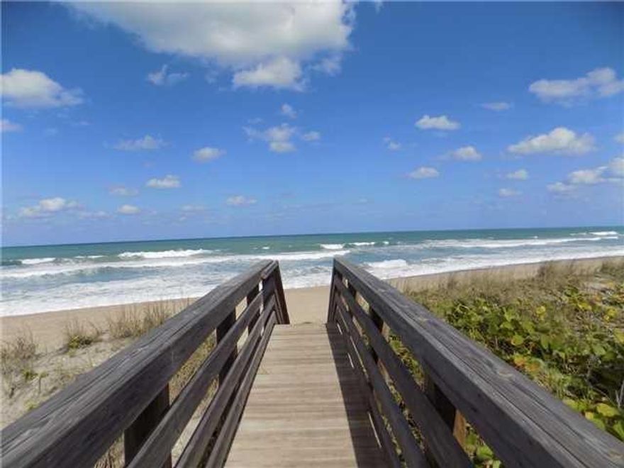 Coastal living at it's best! Only 18 units in this charming community called ''The Dunes Club''. Pride in ownership is reflected in this well cared for 2 bedroom plus loft, 21/2 bath fully furnished townhome! Very spacious (1300+ AC) bright and airy with white beamed ceilings. Updated baths, kitchen with breakfast bar. Spacious living area, newer AC (approximately 4 years old), new Nest thermostat, interior recently painted, updated electrical, new tankless water heater, new water filtration system, new Plantation shutters, all new light fixtures, new carpet in Master and loft. Pretty screened porch overlooking the pool area. Impact glass windows & Sliders. With just steps to the beach, this is perfect for the buyer looking for that private getaway or all year round beachfront livin Extra bonus; you can rent the townhome for a one month minimum!  Tenants already in place for the rest of the year up until the end of March 2020.