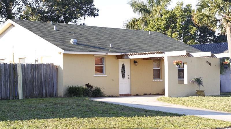 Adorable home for sale in Counter Point Estates. No HOA bathroom remodeled Kitchen counters with granite countertops, tankless water heater, tile flooring throughout,, giant fenced yard. This community is located in a tranquil setting within Royal Palm Beach City limits. Many children can be seen playing in one of 4 parks in the community, which have been recently renovated, and include tot lots, fishing docks, picnic pavilions, a basketball and sand volleyball court and a dog park. Close to great schools and shopping!