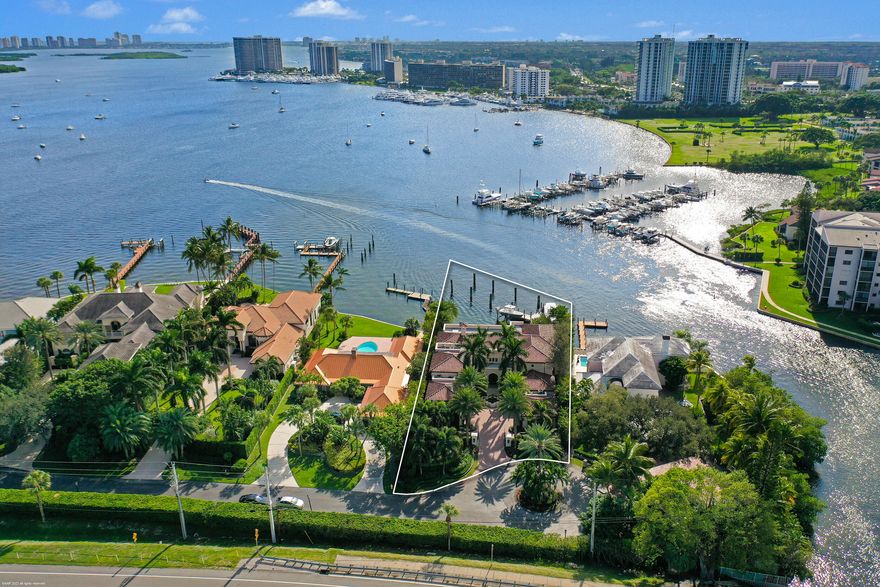 Exceptional opportunity to acquire an unmatched custom estate home in a gated enclave with breathtaking panoramic South exposure views, a completely rebuilt dock with deep water slip for a 100'+ yacht and two lifts (20,000lb & 30,000lb). Easy access to the Ocean with a straight run down Lake Worth to the Palm Beach Inlet. Completely remodeled kitchen with Downsview Cabinetry, Wolf 48'' duel fuel 8 burner range, two side by side SubZero refrigerators, Wolf warming drawer, two Bosch dishwashers, Espresso bar and quartz counters. This home features a poured concrete second floor/staircases, an elevator, tumbled marble floors, pecky cypress ceilings, complete impact windows & doors, full house electrical upgrade including wiring, outlets/switches, 100KW whole house generator and a newer roof!