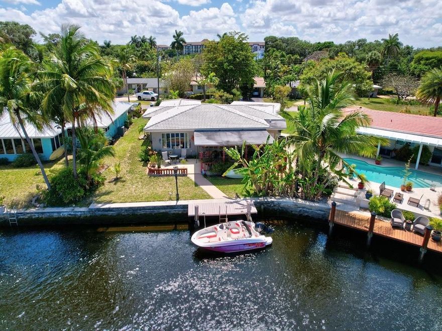 Amazing 3/2, waterfront w/ ocean access, in sought after east Wilton Manors on the north fork of beautiful Middle River. Open floor plan, gorgeous wide sweeping river views in living area & master bedroom. Move in ready, 2018 renovated kitchen & guest bath. Kitchen w/ wood cabinets, quartz countertops, GE stainless appliances & laundry area. Recently refinished terrazzo floors, impact windows & doors thru-out & lots of storage. 2017 tile roof, seawall & private dock w/ concrete pilings. Also includes large covered back patio w/ built-in brick BBQ, 2 walk-in utility rooms w/ storm doors, 2-car carport & full-yard sprinkler system. Great location, walking distance to Wilton Drive, shopping & restaurants, near Las Olas Blvd, 2 miles to beach & 8 miles to Fort Lauderdale Int’l Airport. The listing agent (Anna Woodall O'Toole) is sister to one of the sellers (Bernard Robert Woodall)
