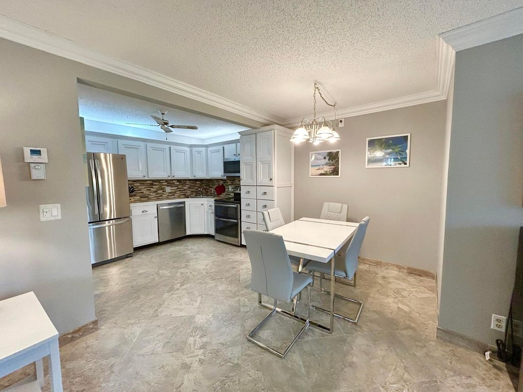 Photo of 223 Pine Hov Circle #C-2, Greenacres, FL 33463 (MLS # B26018806)