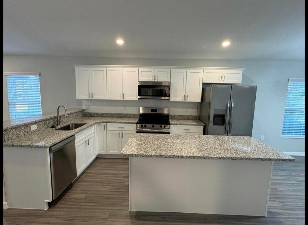Photo of 412 NE Avenue M NE, Winter Haven, FL 33881 (MLS # B26034930)