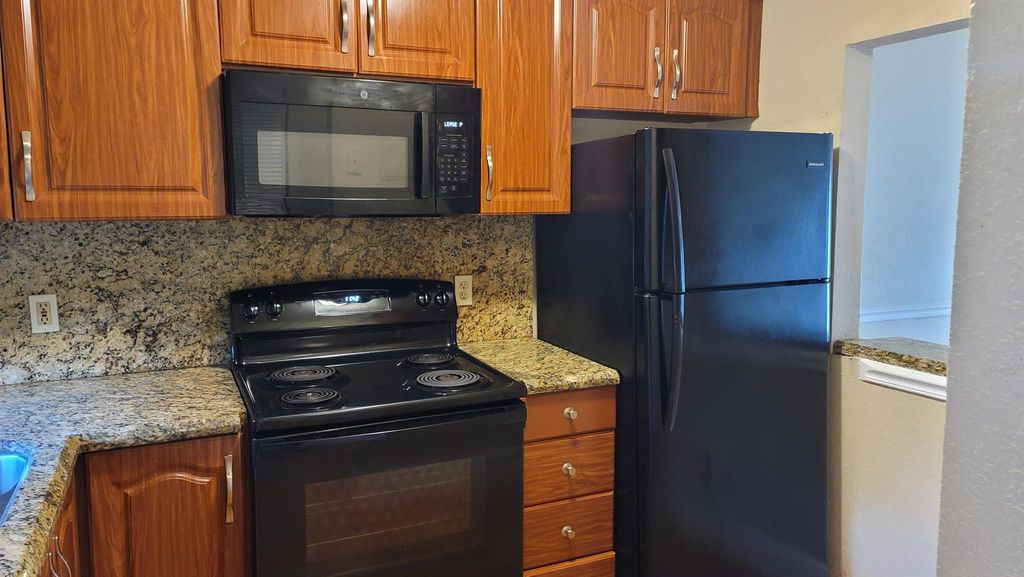 Photo of 1638 Embassy Drive #108, West Palm Beach, FL 33401 (MLS # R10985449)