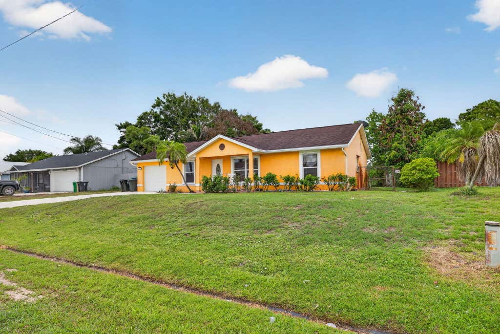 Photo of 1314 SW Bellevue Avenue, Port Saint Lucie, FL 34953 (MLS # B26039247)