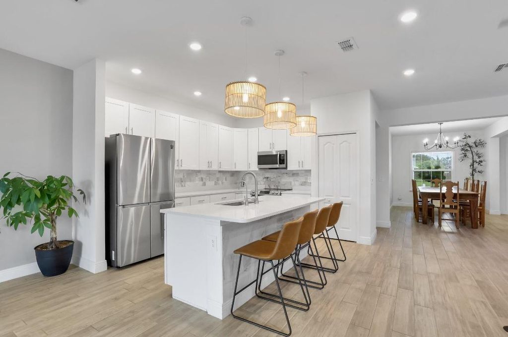 Photo of 3974 SW Jarmer Road, Port Saint Lucie, FL 34953 (MLS # R11094633)