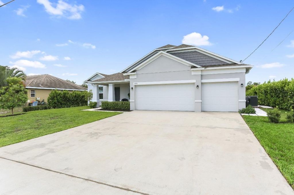 Photo of 3974 SW Jarmer Road, Port Saint Lucie, FL 34953 (MLS # R11094633)