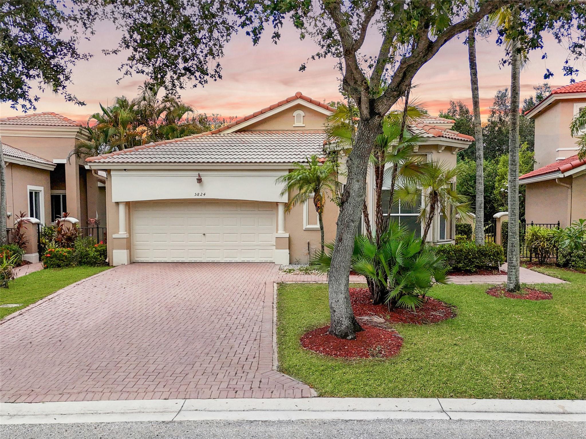 Stunning, open concept and modern 3-bedroom, 2-bath home with a 2-car garage located in the highly sought-after community of Heron Bay! Home features a desirable split floor plan, spacious backyard with a partial lake view, and full accordion shutters throughout for peace of mind. Enjoy brand new appliances and blinds, a 2021 A/C unit, and a completely turnkey interior—move right in! Heron Bay offers resort-style living with 24/7 gated security, and lawn care is included. Don’t miss the chance to live in one of the area's most prestigious communities!