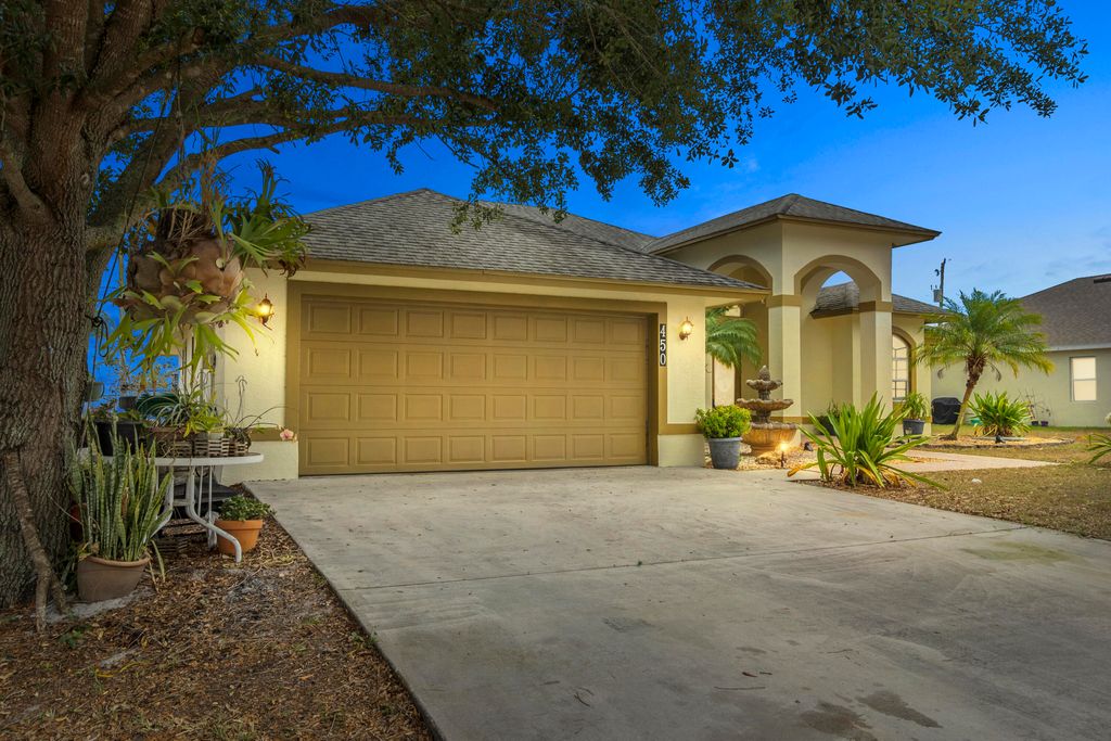 Photo of 450 SW Laconic Avenue, Port Saint Lucie, FL 34953 (MLS # R10793124)