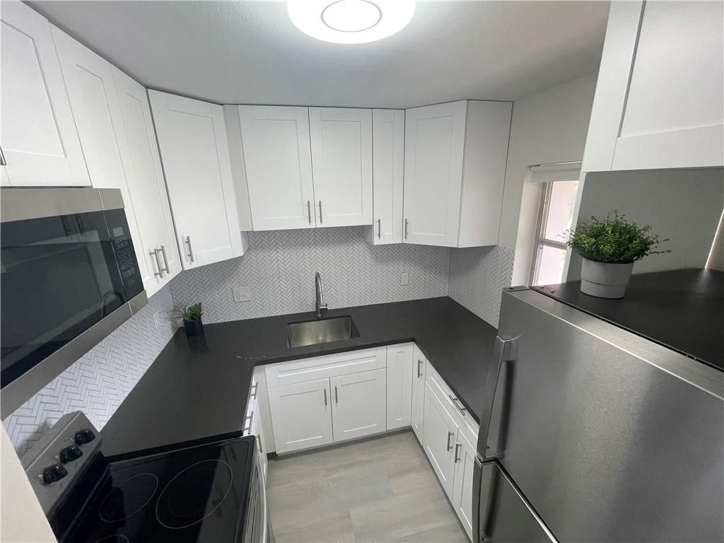 Photo of 3930 Crystal Lake Drive #315, Pompano Beach, FL 33064 (MLS # F10556212)