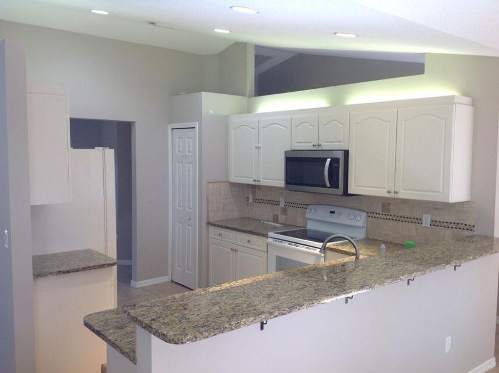 Photo of 1516 SW Escobar Lane, Port Saint Lucie, FL 34953 (MLS # R10982909)