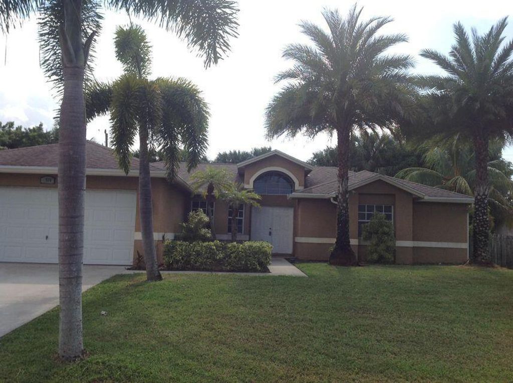 Photo of 1516 SW Escobar Lane, Port Saint Lucie, FL 34953 (MLS # R10982909)