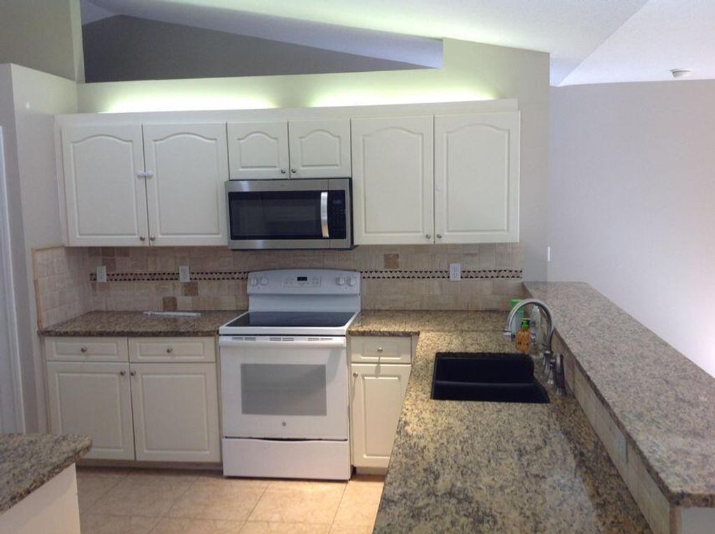 Photo of 1516 SW Escobar Lane, Port Saint Lucie, FL 34953 (MLS # R10982909)