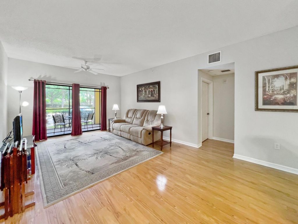 Photo of 3018 Alcazar Place #104, Palm Beach Gardens, FL 33410 (MLS # R10974126)