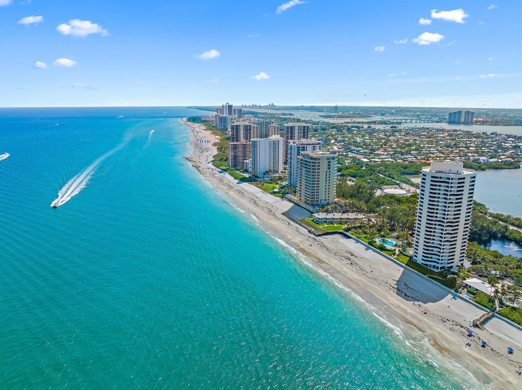 Welcome to your seaside retreat in beautiful South Florida. This beautifully renovated 4th-floor, 1-bedroom, 1-bathroom condo offers breathtaking, unobstructed views of the Atlantic Ocean right from your private balcony. Located directly on the sand of desirable Singer Island, this residence combines modern style with the serenity of coastal living.Inside, the condo features a completely updated interior with an open-concept layout, contemporary lighting, and lovely crown molding.  The kitchen is equipped with contemporary cabinetry, stainless steel appliances, and tile countertops, perfect for both casual meals and entertaining. The spacious bedroom provides a peaceful escape with stunning ocean views to wake up to each morning.