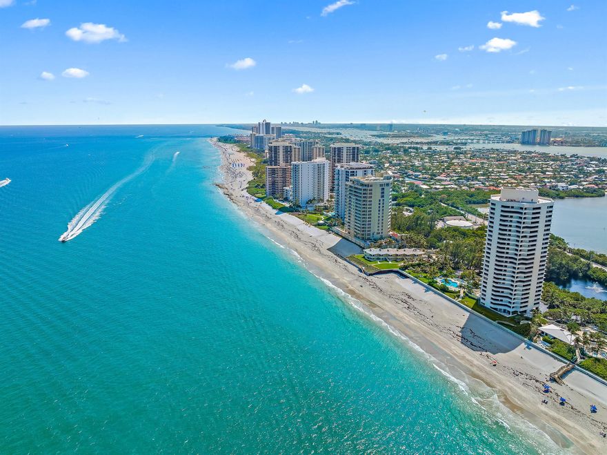 Welcome to your seaside retreat in beautiful South Florida. This beautifully renovated 4th-floor, 1-bedroom, 1-bathroom condo offers breathtaking, unobstructed views of the Atlantic Ocean right from your private balcony. Located directly on the sand of desirable Singer Island, this residence combines modern style with the serenity of coastal living.Inside, the condo features a completely updated interior with an open-concept layout, contemporary lighting, and lovely crown molding.  The kitchen is equipped with contemporary cabinetry, stainless steel appliances, and tile countertops, perfect for both casual meals and entertaining. The spacious bedroom provides a peaceful escape with stunning ocean views to wake up to each morning.