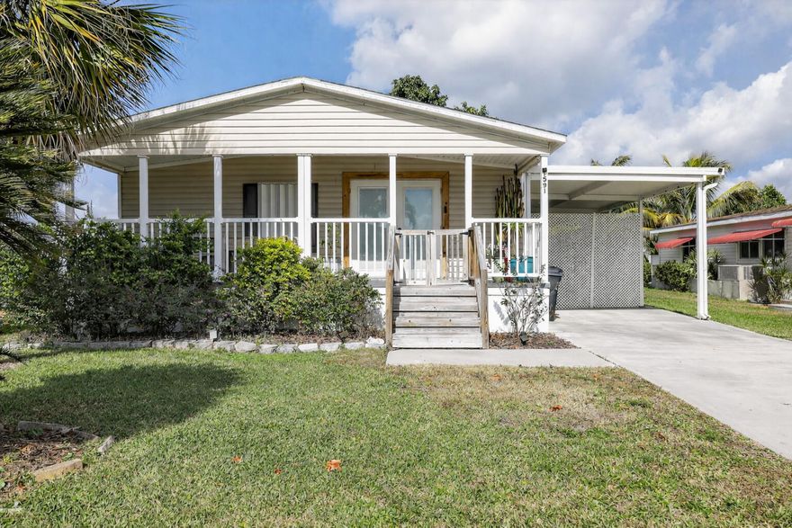 This 3 bed/2 bath manufactured home with 1,323 sq ft. Built on 2006, property is situated on 0.15-acre lot. Interior professionally smoothed for a modern look, new flooring throughout, and an upgraded kitchen with wood cabinets, laminate counters, and stainless steel appliances. New heater and water heater cut immediate expenses. Exterior shows strong curb appeal with clean landscaping, a palm tree, large carport, and driveway for more than 2 vehicles. Key systems updated and cosmetic work done turnkey investment ready for rental or resale with minimal effort.