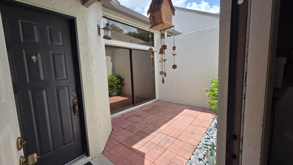 Photo of 705 Landings Boulevard, Greenacres, FL 33413 (MLS # B26015341)