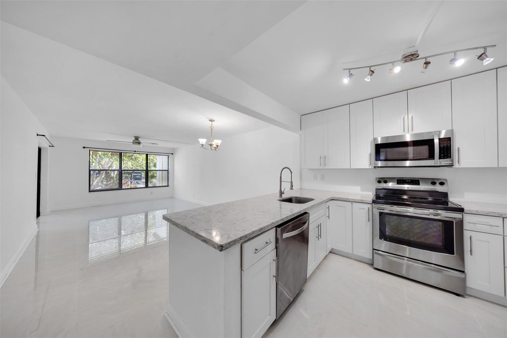 Photo of 2300 S Cypress Bend Drive #203, Pompano Beach, FL 33069 (MLS # F10507148)