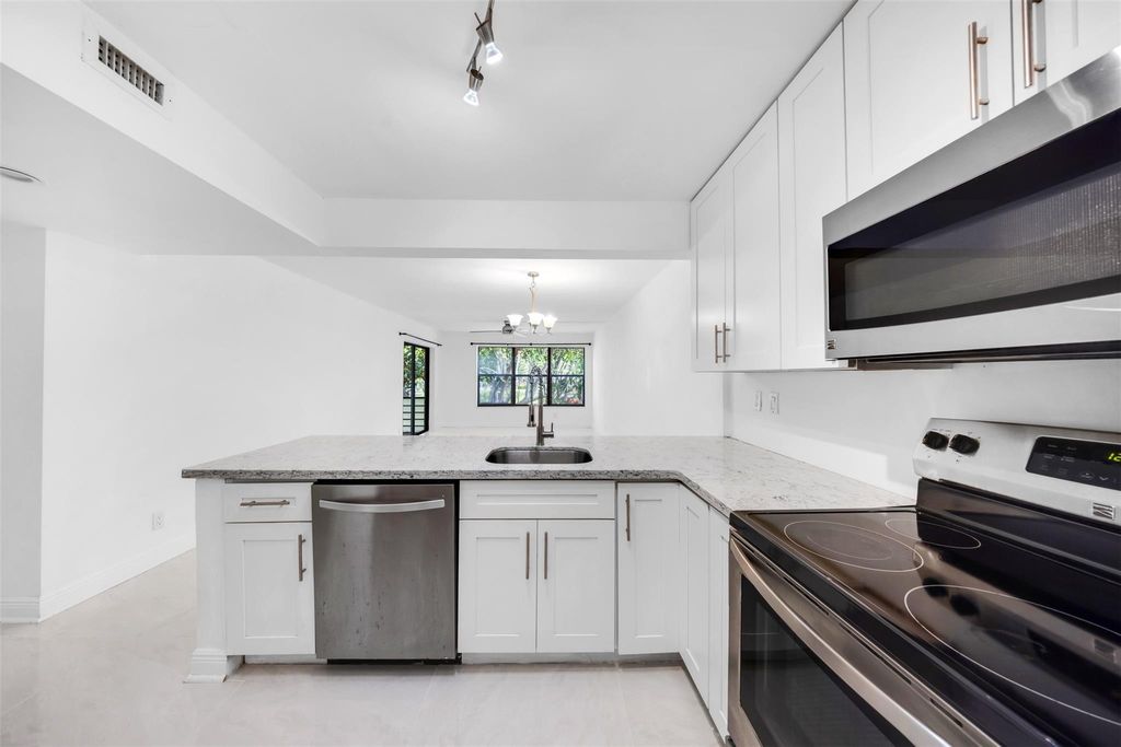 Photo of 2300 S Cypress Bend Drive #203, Pompano Beach, FL 33069 (MLS # F10507148)