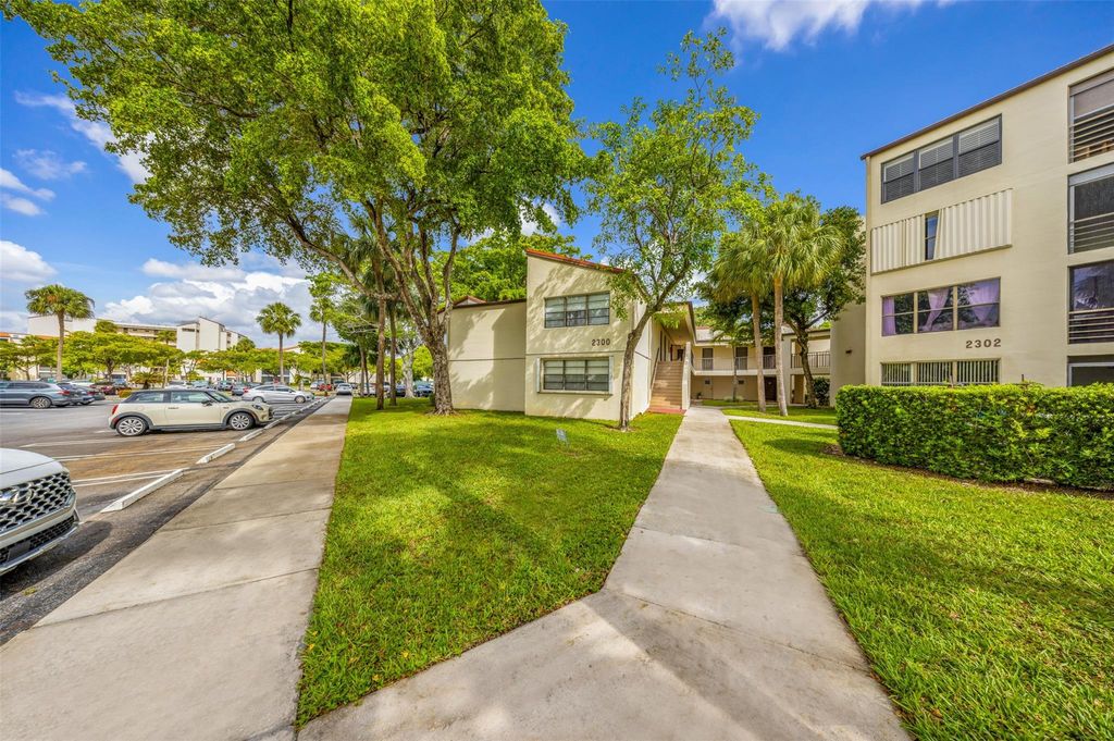 Photo of 2300 S Cypress Bend Drive #203, Pompano Beach, FL 33069 (MLS # F10507148)