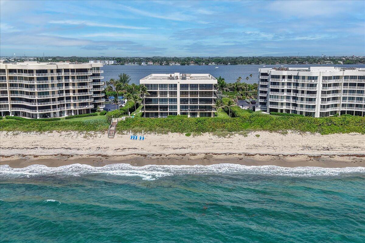 Welcome to your dream Palm Beach retreat! This elegant boutique condominium offers breathtaking, panoramic views of both the Atlantic Ocean and Intracoastal Waterway from every room. Step onto your private wrap-around balcony and watch the sunrise over the waves, or enjoy an evening breeze as the sun sets over the pool. Featuring 3 spacious bedrooms, 3 updated bathrooms, and an open concept living space with floor to ceiling windows, this home seamlessly blends luxury and comfort. The primary suite includes direct balcony access, an oversized walk-in closet, and an en-suite bathroom with all luxury finishes. This condo also comes with your own private, deeded 180 sq ft Pool Cabana which has been thoughtfully decorated with a coastal chic vibe, includes a full bathroom,
