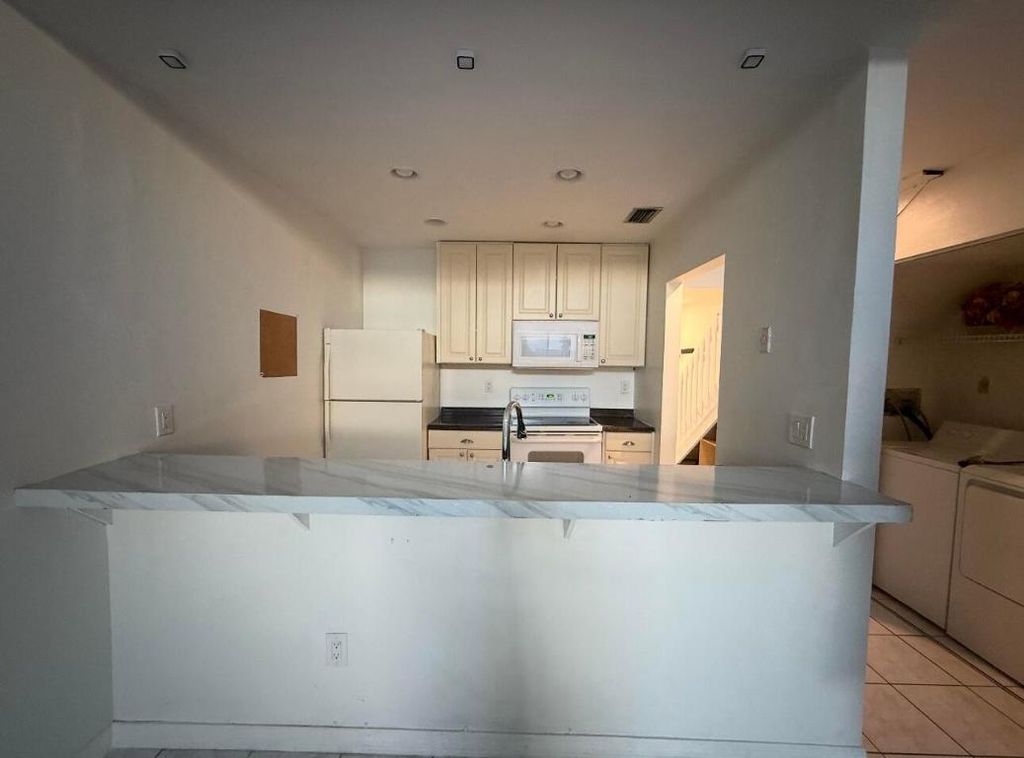 Photo of 1150 Parkside Green Drive #C, Greenacres, FL 33415 (MLS # R11148666)