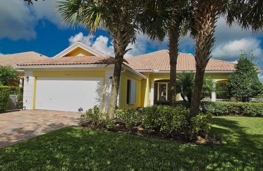 Beautiful Lake view 4/3/2 in the popular Lakes of Tradition. This home offers lots of living space with a formal dining room and living room with a decorative fireplace. Large great room with kitchen, dining and breakfast bar, with wall to wall sliders with a view of the lake and beautiful white plantation shutters. Spacious master bath with his and her sinks, garden tub and separate shower. The covered screened patio and backyard sit right on the lake with a decorative fence, great for outdoor entertaining. Accordion storm shutters secure all windows. This property has two HOA's (Tradition Community and The Lakes). HOA fee includes lawn care, exterior paint, basic cable, high speed internet, alarm monitoring, common area maintenance and community pool.