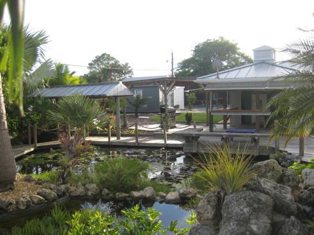 Photo of 1168 SE Palm Beach Road, Port Saint Lucie, FL 34952 (MLS # R10700947)