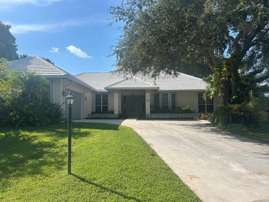 Welcome to this stunning custom built CBS home, nestled in a small, gated community of just 39 all custom residences. The coquina stone fireplace is a true centerpiece that adds warmth and character to the living area.  French doors lead to the under air sunroom - perfect for relaxing and enjoying the quiet solitude of the tropical backyard. This home is also less than 3 miles to beaches, stores and restaurants. Over a 1/4 acre corner lot that has plenty of room for a pool if desired.  New well was just installed for the automatic sprinkler system.  Full house Generac generator.  Gas stove in the chef's kitchen with a large pantry for all of your entertaining. Plenty of storage throughout house and a 3rd garage for a car, motorcycle, small boat or golf cart.