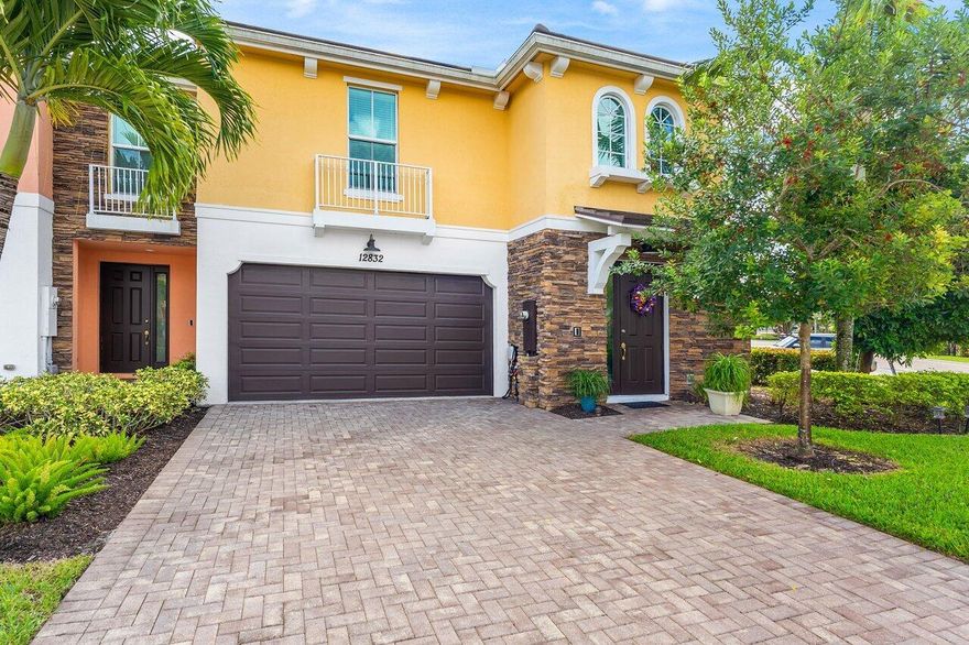 Stunning corner townhome in Trevi Isle with private preserve views located in the heart of Palm Beach Gardens! Enjoy luxury living in this beautifully upgraded end-unit townhome, perfectly positioned on a serene private preserve. This two-story, 3-bedroom, 2.5-bath home features a desirable first-floor primary suite and a versatile loft--ideal for a home office or media space.The open-concept layout showcases an upgraded kitchen with granite countertops, premium cabinetry, and GE stainless steel appliances, all overlooking a bright and inviting living area. Elegant porcelain tile laid on the diagonal spans the main living spaces, while the stairs, loft, and hallways feature stylish wood-look vinyl flooring for a modern touch.