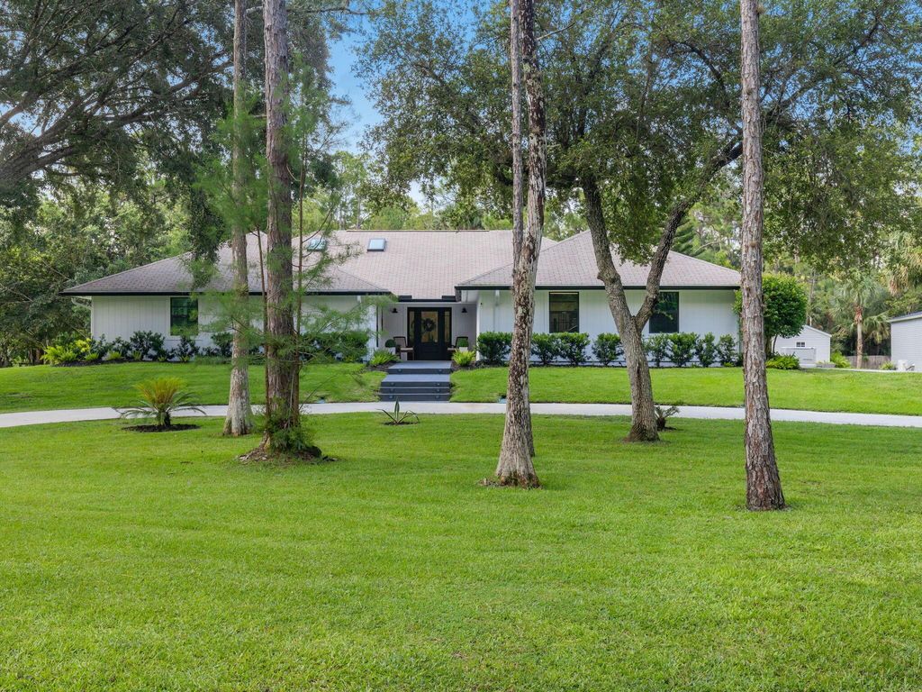 Photo of 9544 Mockingbird Trail N, Jupiter, FL 33478 (MLS # R10901178)