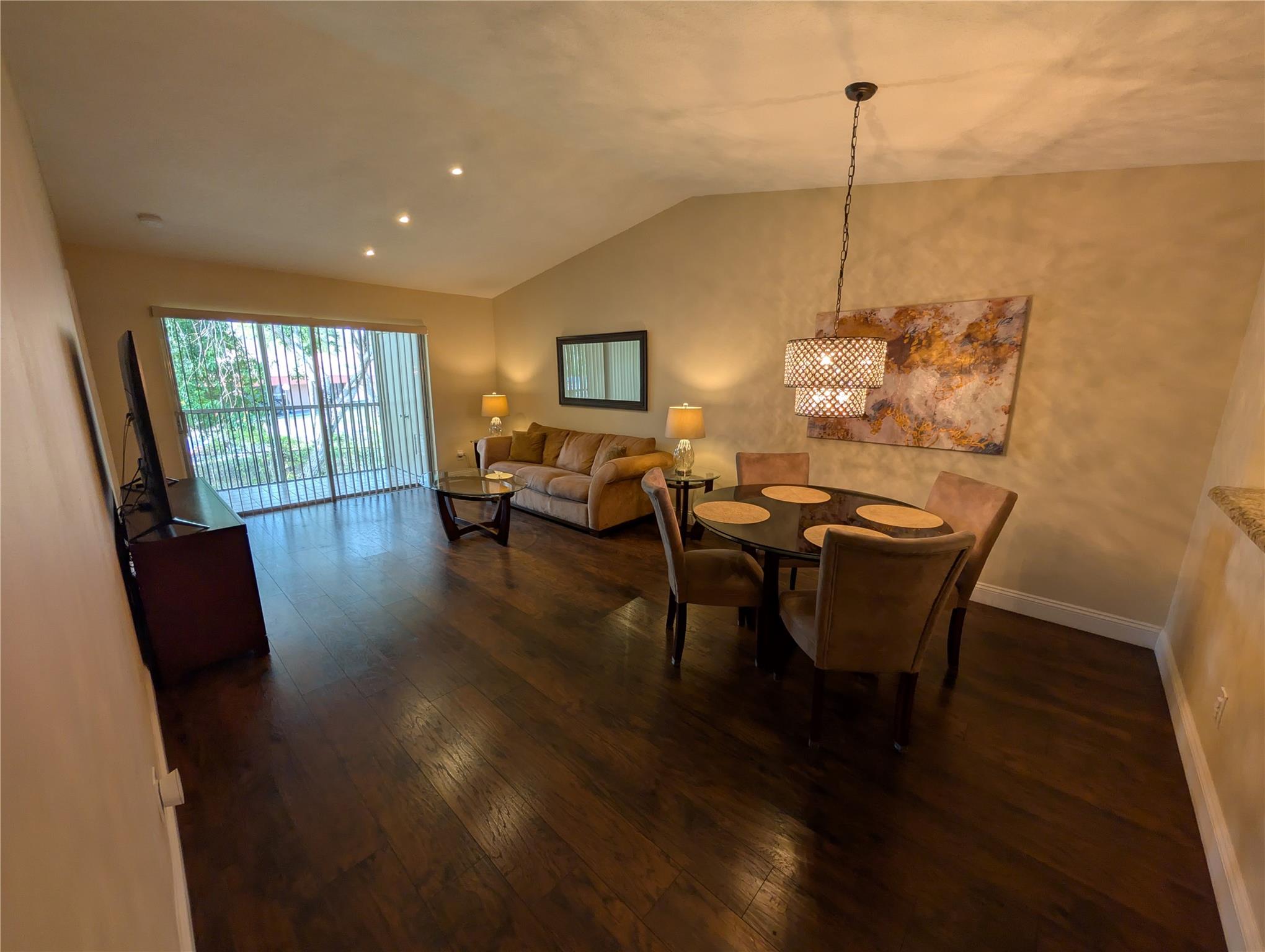 Just Reduced! Discover the perfect blend of comfort and convenience in this beautifully maintained 2-bedroom, 2-bath condo located in the desirable Golfside community of Holiday Springs. Enjoy access to all the fantastic amenities of Holiday Springs Village, including a clubhouse and resort-style pool, along with the exclusive private screened pool within Golfside. This move-in-ready home features an updated kitchen with granite countertops, a newer A/C unit, and a full-size washer and dryer conveniently located on the enclosed balcony. Vaulted ceilings and spacious rooms with wood flooring throughout enhance the charm and openness of the space. Located in a vibrant and active 55+ (HOPA) community, this condo is impeccably clean and ready for you to call home. Schedule your showing today!