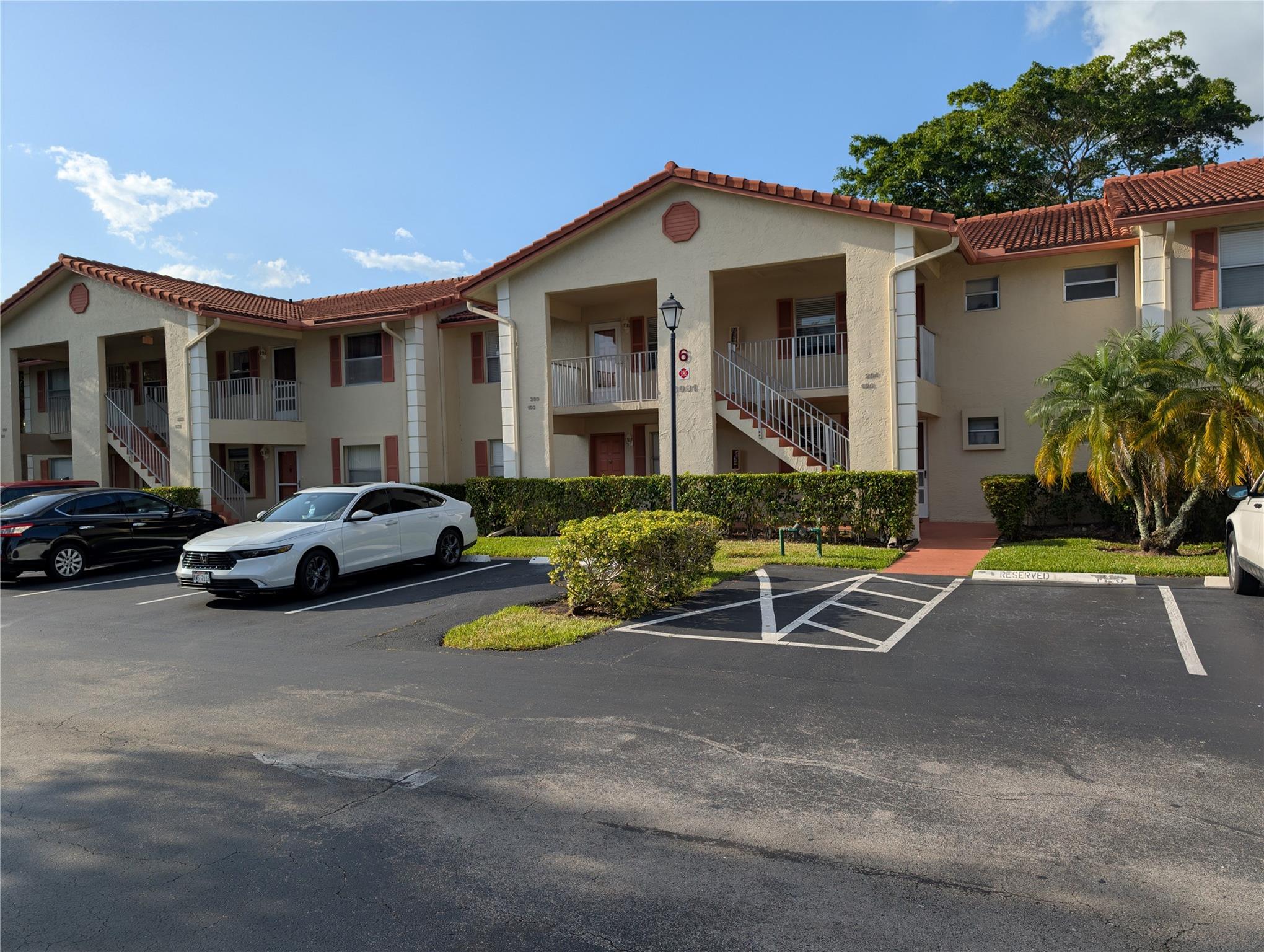 Just Reduced! Discover the perfect blend of comfort and convenience in this beautifully maintained 2-bedroom, 2-bath condo located in the desirable Golfside community of Holiday Springs. Enjoy access to all the fantastic amenities of Holiday Springs Village, including a clubhouse and resort-style pool, along with the exclusive private screened pool within Golfside. This move-in-ready home features an updated kitchen with granite countertops, a newer A/C unit, and a full-size washer and dryer conveniently located on the enclosed balcony. Vaulted ceilings and spacious rooms with wood flooring throughout enhance the charm and openness of the space. Located in a vibrant and active 55+ (HOPA) community, this condo is impeccably clean and ready for you to call home. Schedule your showing today!