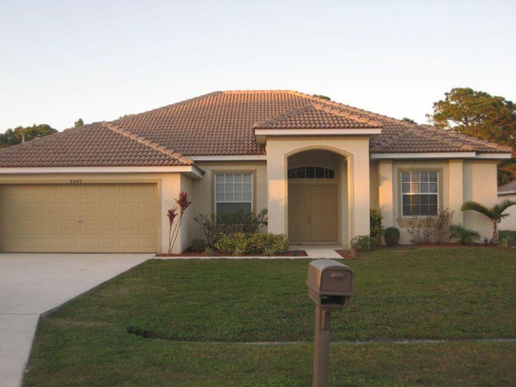 Photo of 6049 NW Wesley Road, Port Saint Lucie, FL 34986 (MLS # R10807713)