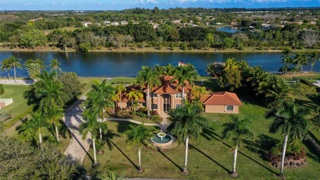 Photo of 5660 Lago Del Sol Drive, Lake Worth, FL 33449 (MLS # B26044952)