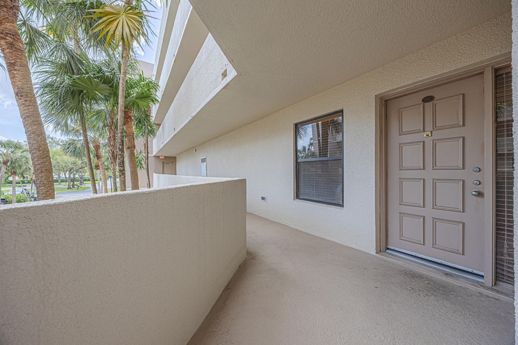 Photo of 5750 Camino Del Sol #202, Boca Raton, FL 33433 (MLS # B26002121)