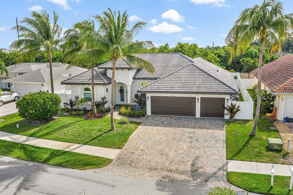 Photo of 596 N Cypress Drive, Tequesta, FL 33469 (MLS # B26058286)