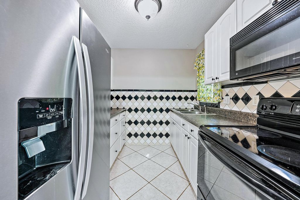 Photo of 733 Hummingbird Way #10, North Palm Beach, FL 33408 (MLS # R11101528)