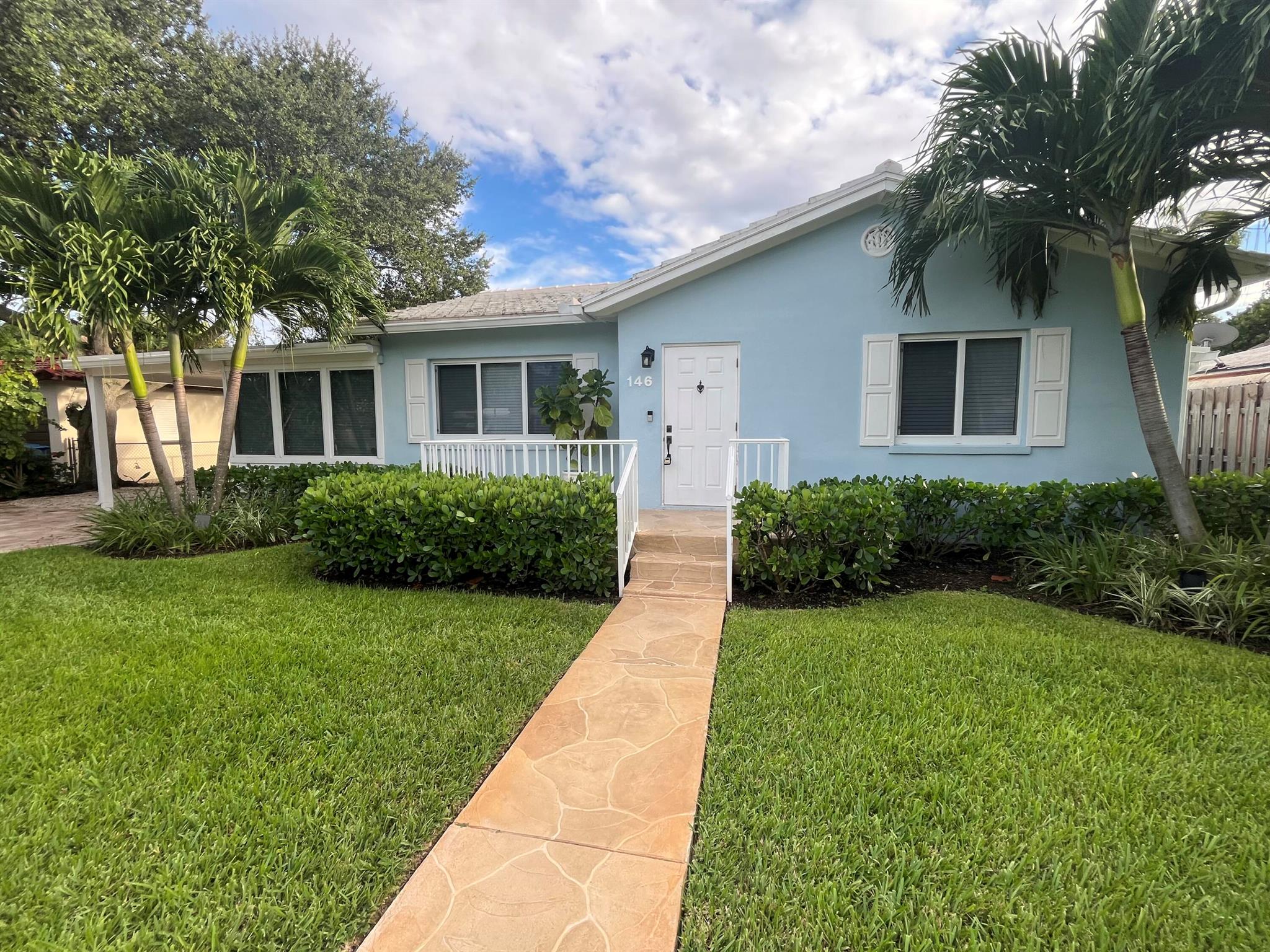 Welcome to your perfect Florida retreat! This spacious 3-bedroom, 2.5-bath home is just a short walk to the beach and local restaurants, offering you the ultimate coastal lifestyle. Located on a beautiful street, only a few houses from the Intracoastal, enjoy a scenic water view at the end of the road. The large lot provides ample outdoor space, featuring a generous master suite with a private patio for morning coffee or evening relaxation. This home is equipped with impact windows for peace of mind, a convenient carport, and an in-unit laundry room for added ease. Live the Florida dream in this well-maintained home surrounded by natural beauty and coastal charm. Don't miss this rare opportunity!