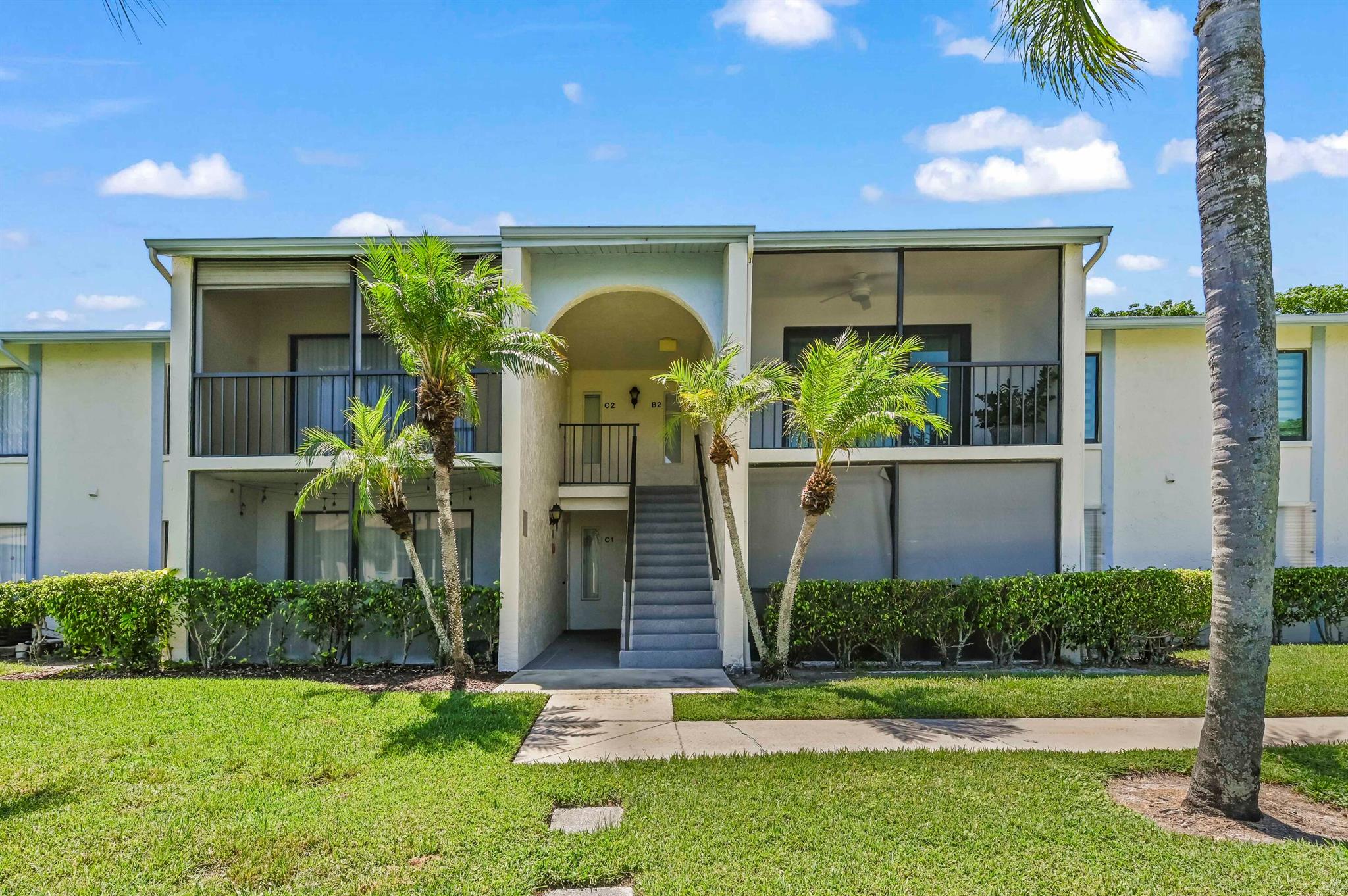 Welcome to Palm Club Village II Condo, a 24/7 manned and gated community offering comfort and convenience. This spacious and renovated lake view condo features 1,106 sq. ft. of living space, including 2 bedrooms and 2 bathrooms and laundry room. The home boasts and entire kitchen remodel, new electrical outlets, newer AC, light fixtures, ceiling fans with tile flooring in the living, dining, and kitchen areas with laminate flooring in all bedrooms. The kitchen features granite countertops with a bar setting and brand new appliances including a refrigerator, range, oven, and microwave, perfect for both everyday living and entertaining. A laundry area with a washer and dryer adds convenience.