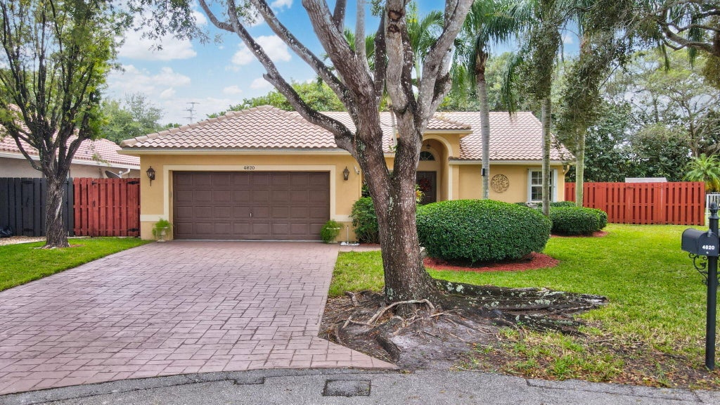 Photo of 4820 NW 75th Street, Coconut Creek, FL 33073 (MLS # R11036011)
